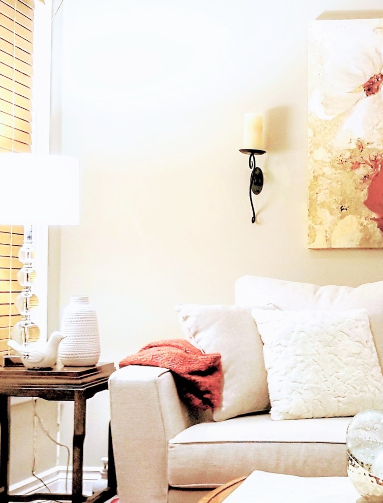 This is a photo of the refreshed living room owned by the Newmarket, Ontario empty nesters. The contemporary loveseat is upholstered with a neutral coloured fabric which make the loveseat perfect for home staging.