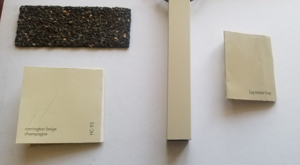 A mood board showing how the shingles, sand coloured railings and paint chips look in front of a west facing window that is in my office. The wood chips look beige indoors.