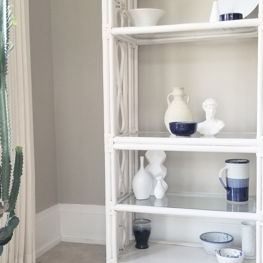 Styled shelf with blue and white accessories.